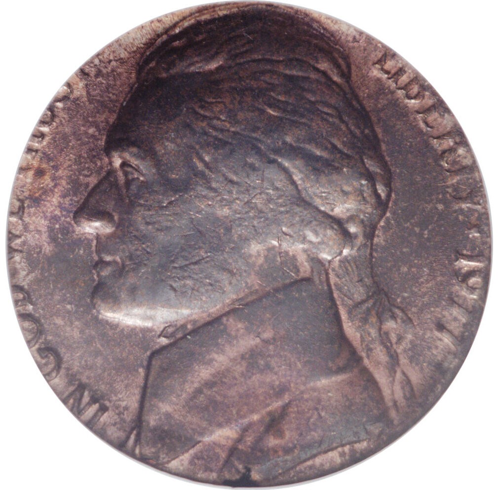 1977 nickel struck on wrong copper cent planchet showing smaller diameter and coppery tone compared to normal nickel